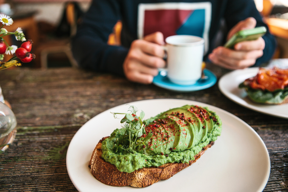 This avocado toast is green and filled with avocado and paprika! It is some of the best brunch in Atlanta. 