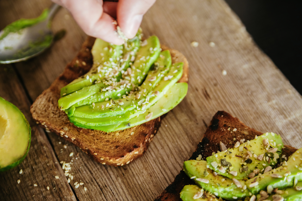 Photo of two slices of avocado toast from Maximón, some of the most delicious breakfast in Baltimore