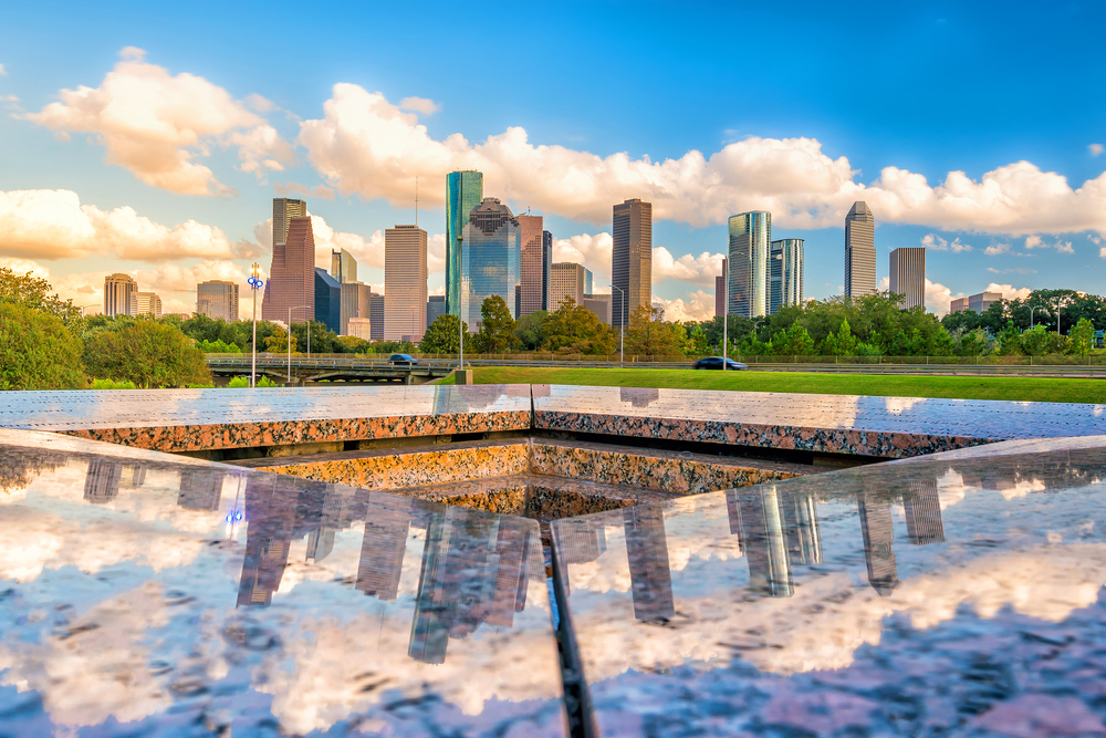 Houston skyline on a cloudy day reflected in granite.