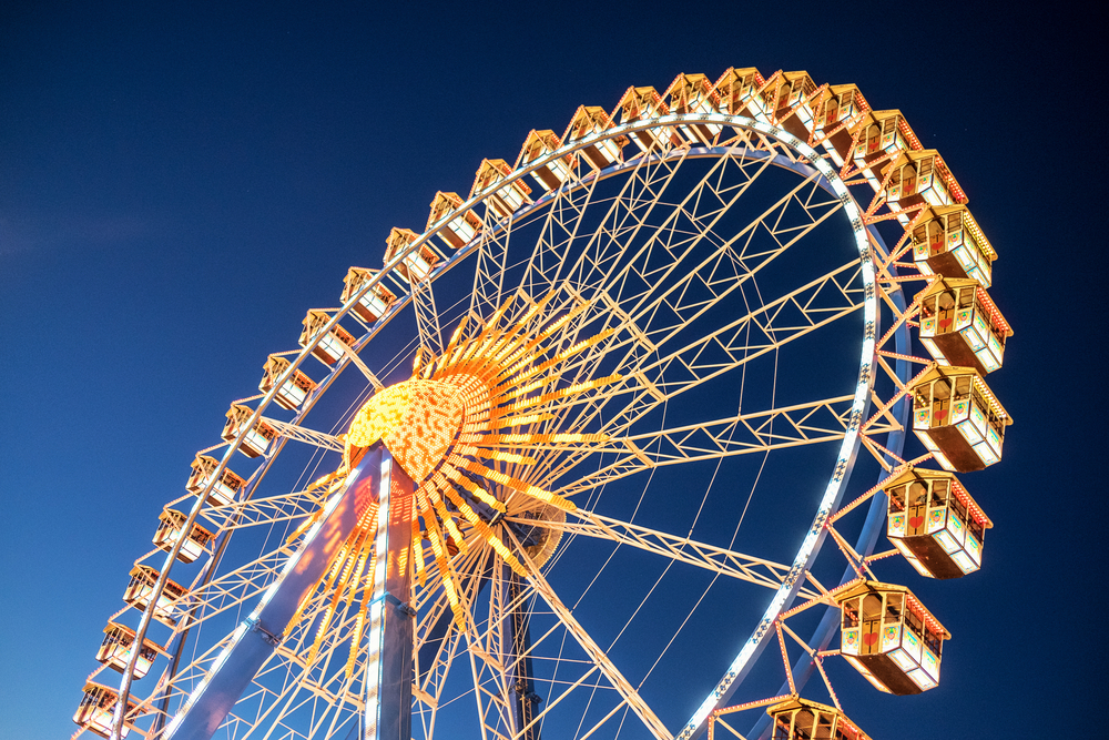 a beautiful Ferris wheel with lights at night in Baltimore MD 