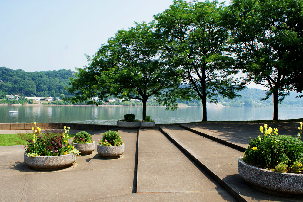 large stairs and flower pots running alongside the river in west virginia