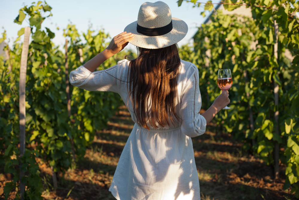 a girl walking through one of the wineries in Northern Virginia