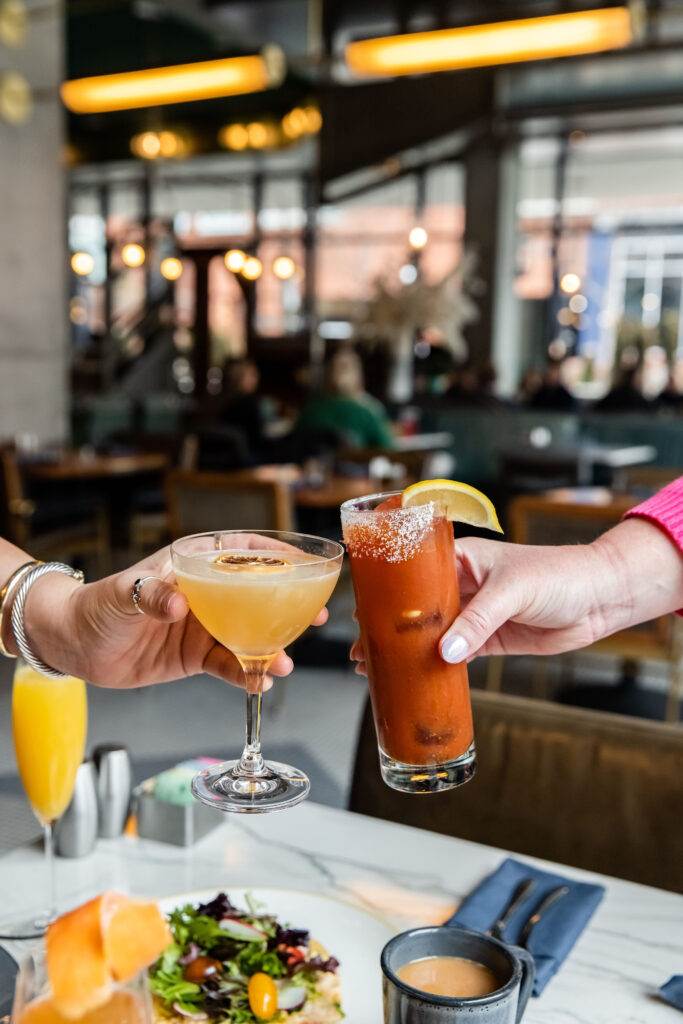 Bloody Marys and martinis in a cheers at brunch in Austin 