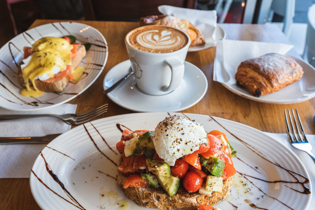 Breakfast spread across the table with coffee and pastries