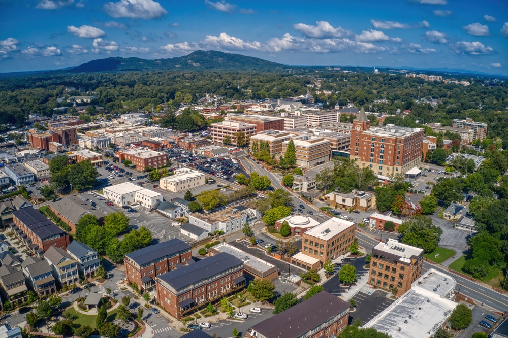 aerial photo of marietta georgia showing city buildings and mountain