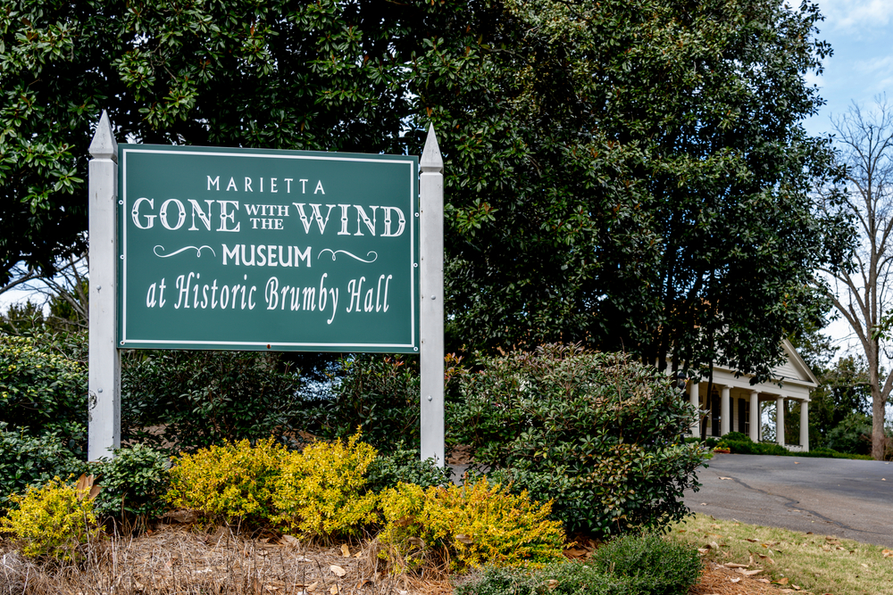 a sign that reads Marietta Gone With The Wind Museum at Historic Brumby Halls