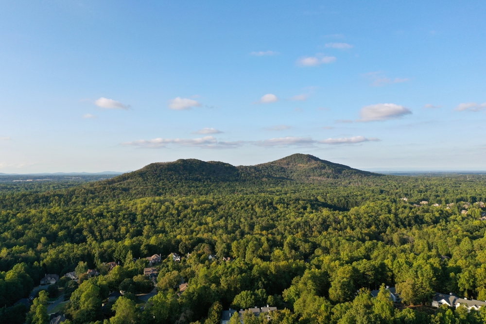 an aerial photo of trees and a mountain on a clear day near marietta