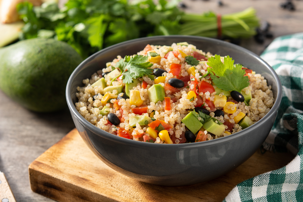 A mixture of quinoa, avocado, parsley, corn, beans and tomato is a fresh vegan and veggie option many locations and is some of the best brunch in Charlotte.