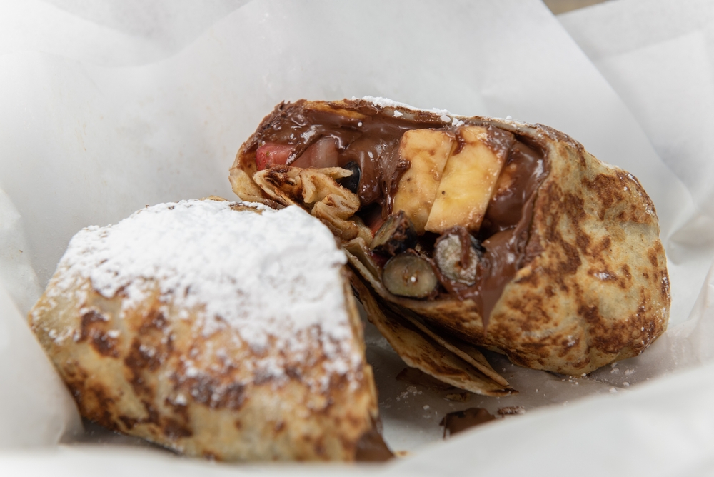 A French toast stuffed burrito anyone? Talk about a sweet tooth: egg bread, crepe wrapping, bananas, powdered sugar and Nutella!