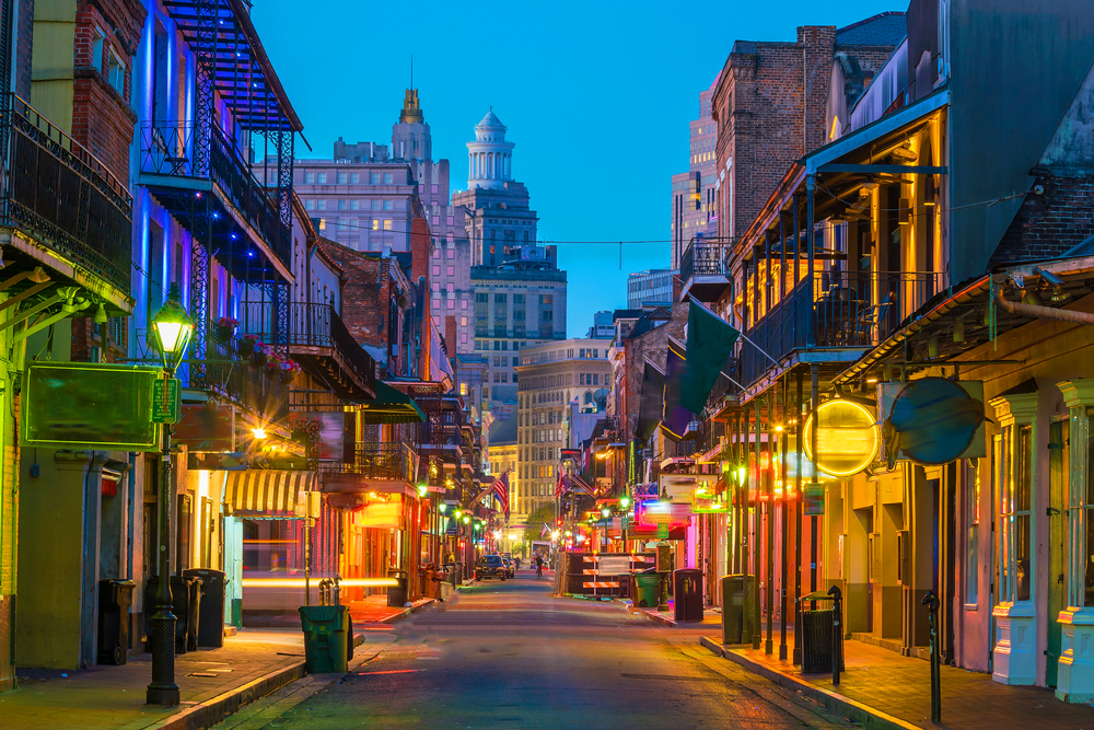 At night the street lights of New Orleans in the French Quarter glow over the still city. 