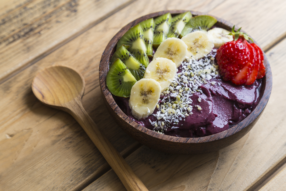 Acai bowl topped with kiwi, banana, strawberry, and coconut shavings at First Watch. 