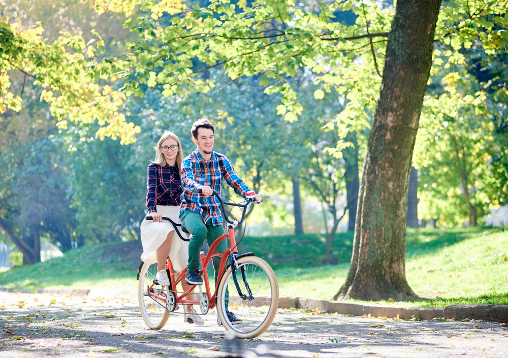 a couple riding a bike, it is one of the best things to do in St Simons Island