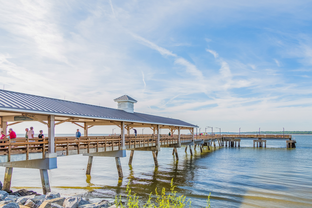 the beautiful pier with people on it in st. Simon island GA 