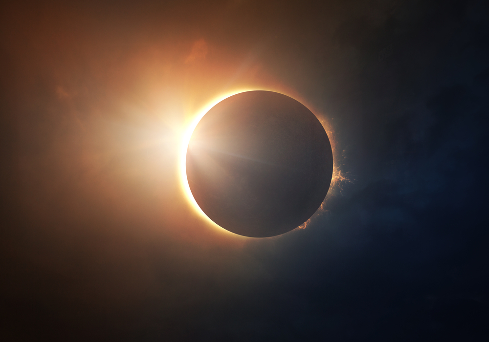 A digital illustration of a solar eclipse, with some golden light around the edge of the moon.