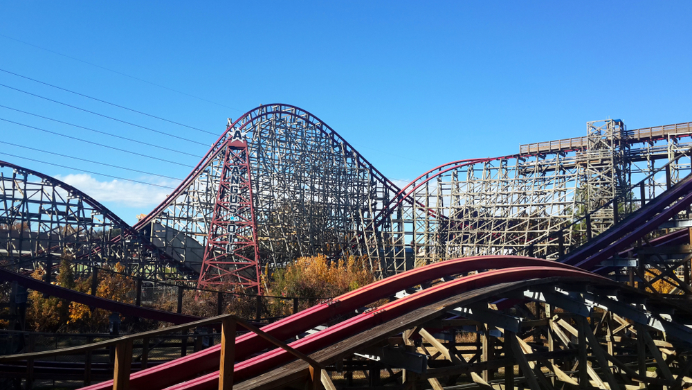 The coasters of Six Flags and Dallas are large with huge purple tracks, lots of support beams, and many carts. 
