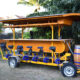 fun bike bar in dallas for adults with yellow cart with beer barrel