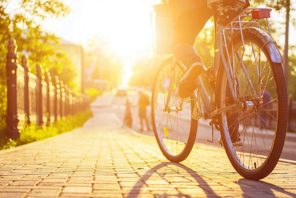 people riding bikes at sunset to see all the best things to do in Dallas for adults 