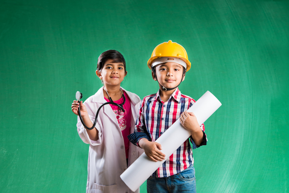 Young girl trying out being a doctor and young boy trying out as a construction worker at KidZania, one of the best things to do in Dallas with kids. 