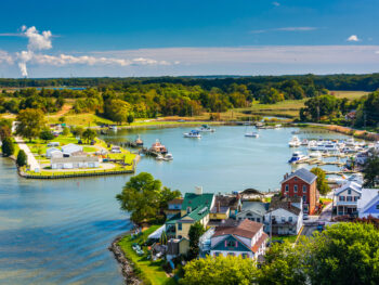 cute little buildings and boats line up along the coast of one of the towns in the chesapeake bay!