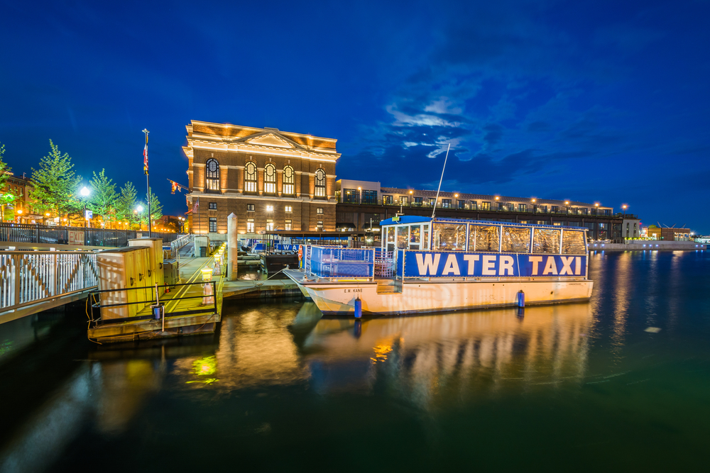 the water taxi in Maryland docked with lights 