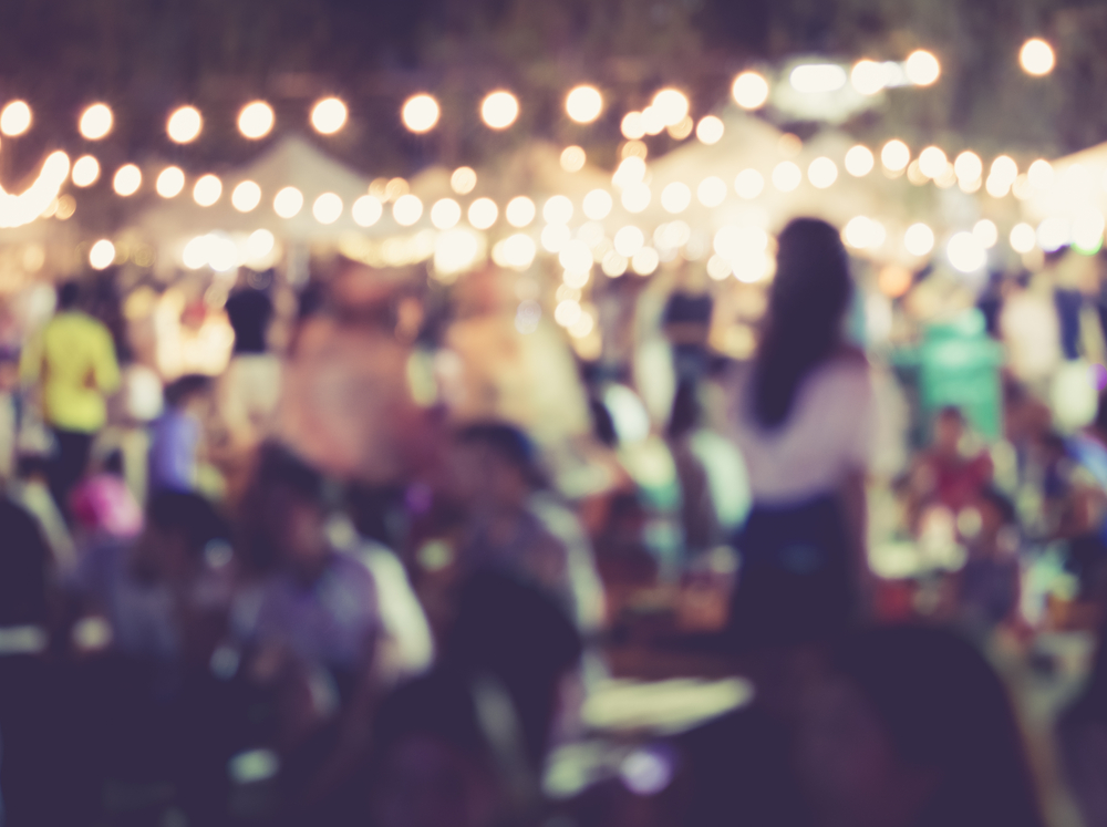 A blurred photo with Christmas lights in the background show how crowded areas can be during Christmas time in Nashville.