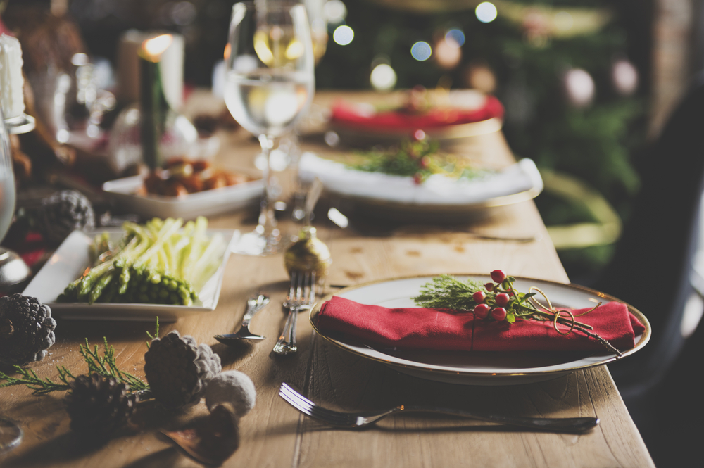 This dinner set features a classic Christmas approach: red napkins, wine glasses, holiday plates and more. You'll see a similar set up at the Belmont mansion! 