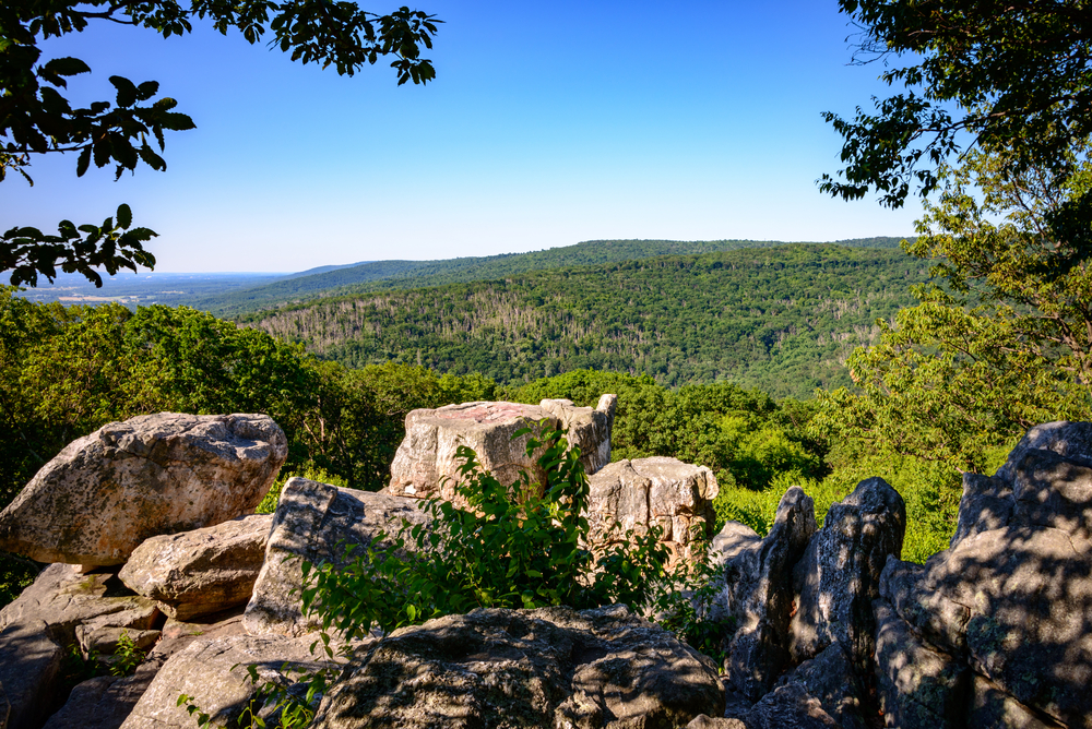 view over the blue ridge mountains with acres of green land and trees during the day