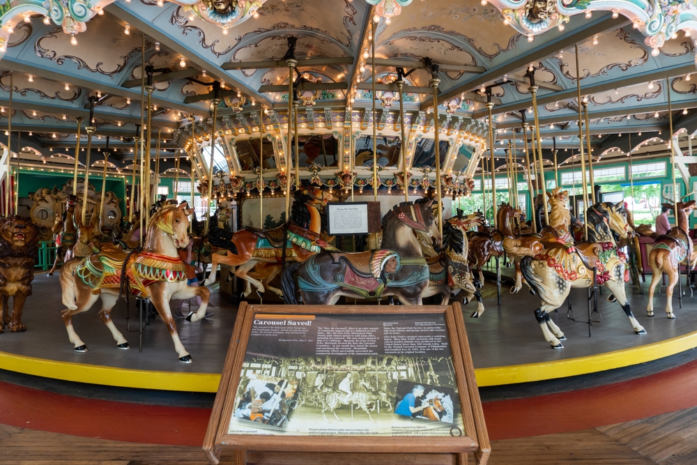 view of the restored Dentzel carousel at glen echo, one of the best national parks in Maryland, with an information area in the front view of the photo  
