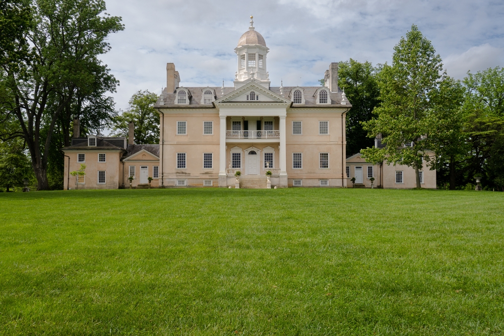 view of the Hampton national historic site from the front, with a large yard with green grass 