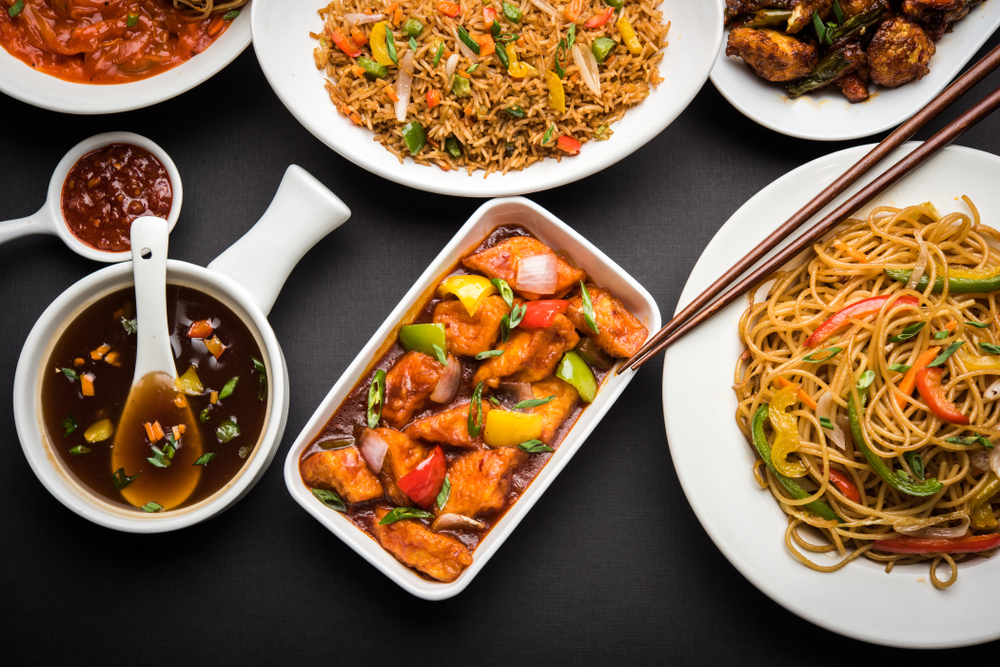 An array of food including chow mein, fried, rice, and more from Golden Sun, one of the best Chinese restaurants in Athens. 