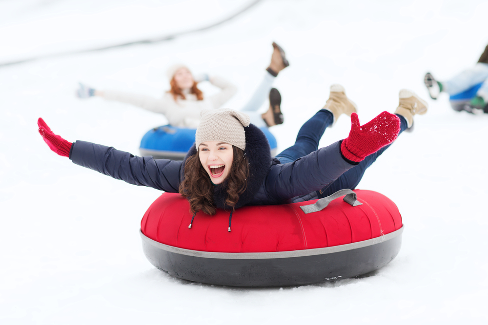 a girl sliding down the field at the gaylord during winter 