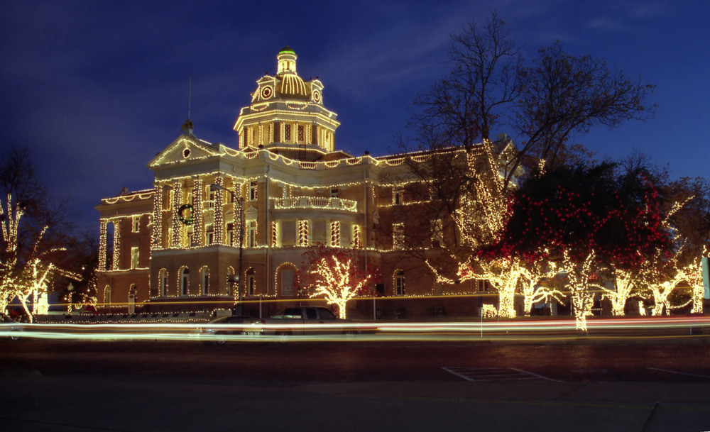 City hall lit up during the evening with bright and festive white Christmas lights to ring in the holiday season!