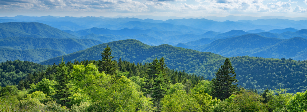 blue ridge mountains during a bright sunny day, where you might find some of the best caves in North Carolina 