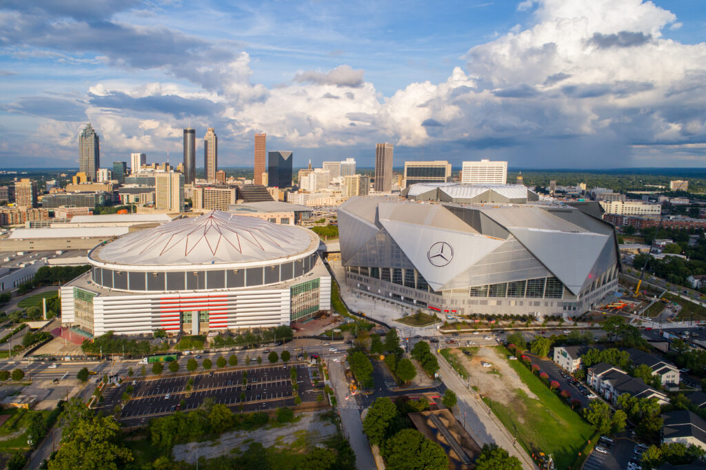 two stadiums next to each other in atlanta, skyline in the background on a cloudy day living in Georgia 