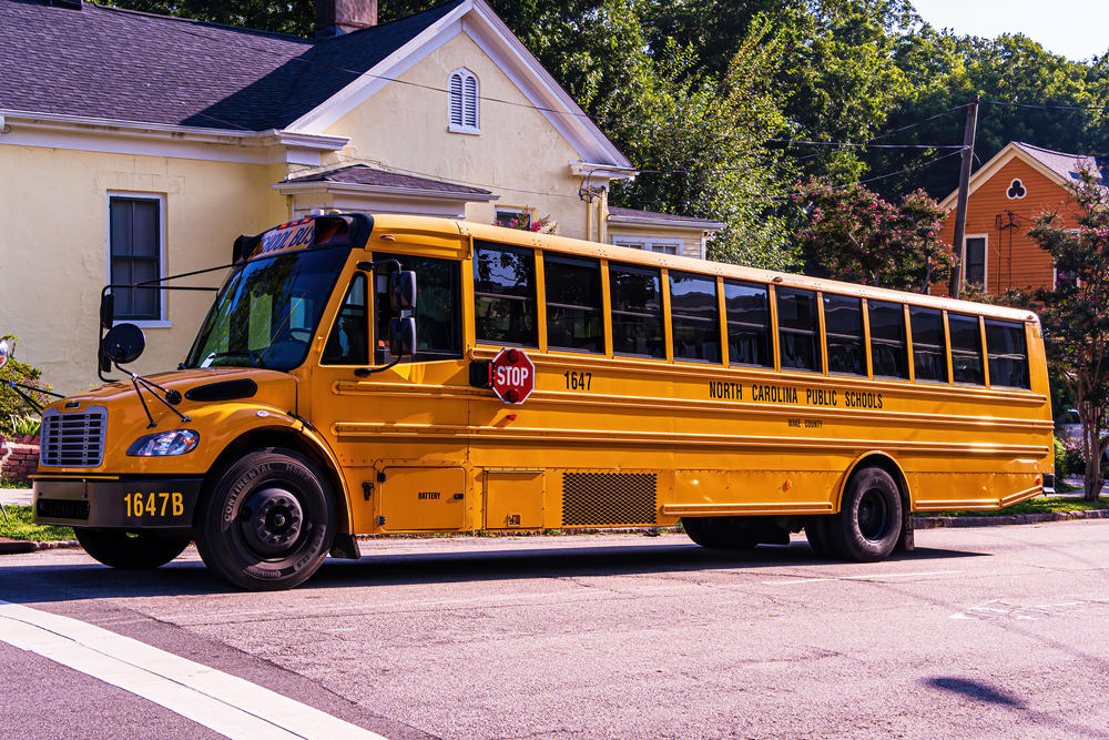 Yellow School bus on a road in North Carolina. 