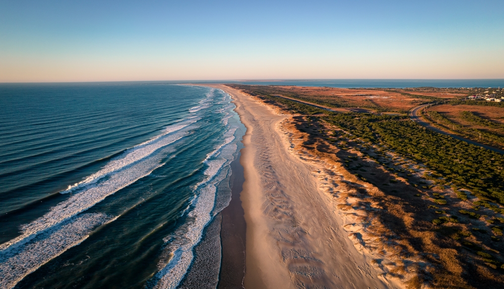 the view of the Ocracoke campground with no one on the beach at sunrise 