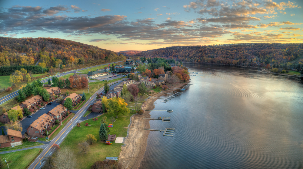 arial view of deep creek lake during the fall with the trees changing colors at sunset, one of the best state parks in maryland 