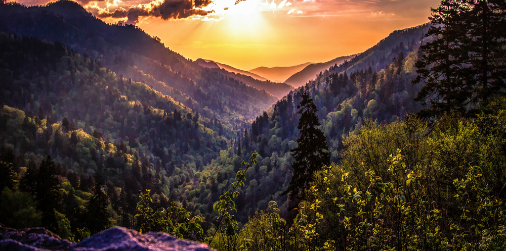 Photo of sunrise over the Great Smoky Mountains, one of the beautiful views you can see living in Tennessee. 