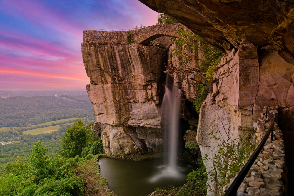 the rock city gardens at lookout mountains at sunset with a blue and purple skies 