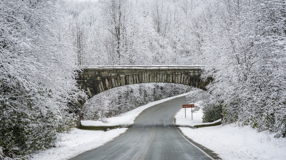 a beautiful snow covered bridge in the middle of Boone in winter!