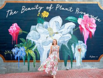 woman standing in front of mural in savannah georgia