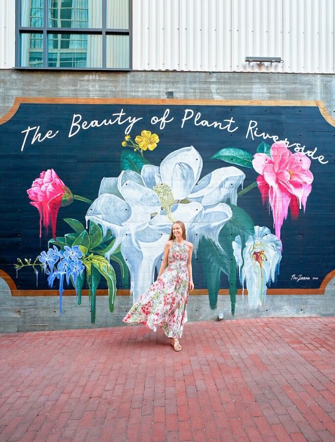 woman standing in front of mural in savannah georgia