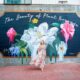 woman standing in front of mural in savannah georgia