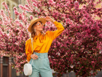 a girl in front of the cherry blossoms