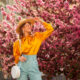 a girl in front of the cherry blossoms