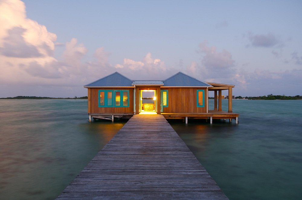 Bungalow over the water with a deck and wrap around porch. One of the best Overwater Bungalows Near The South.