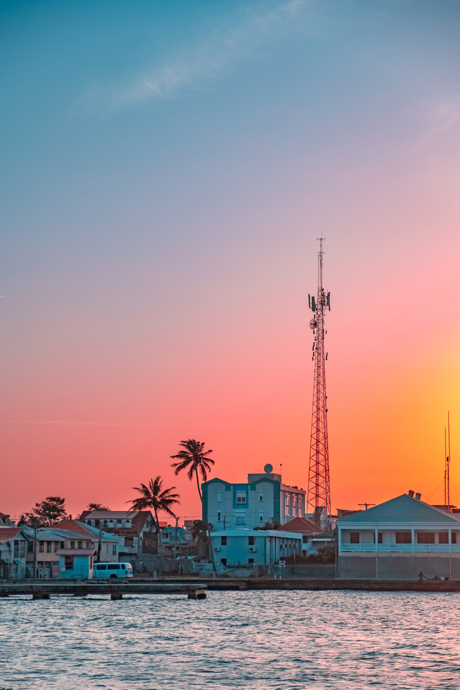 Colorful sunset in Belize with lovely colours. The article is about cheapest places to fly from Houston.